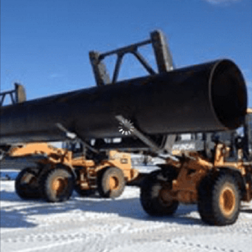 Image of two excavators carrying a large metal pipe